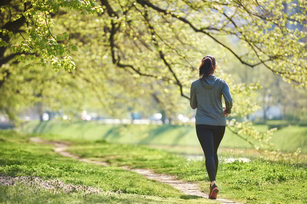 young woman jogging in city park at early morning-3
